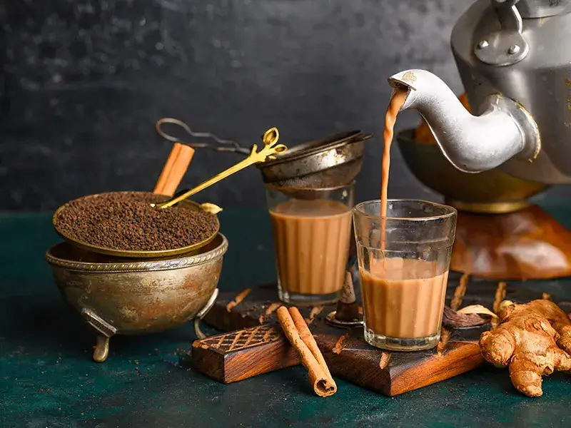 Serving traditional Indian chai
